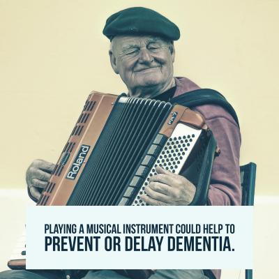Older man plays a musical instrument called the accordion smiling with a statistic about dementia