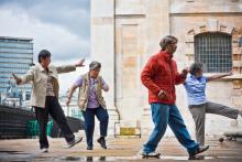 Elderly people doing tai chi outside